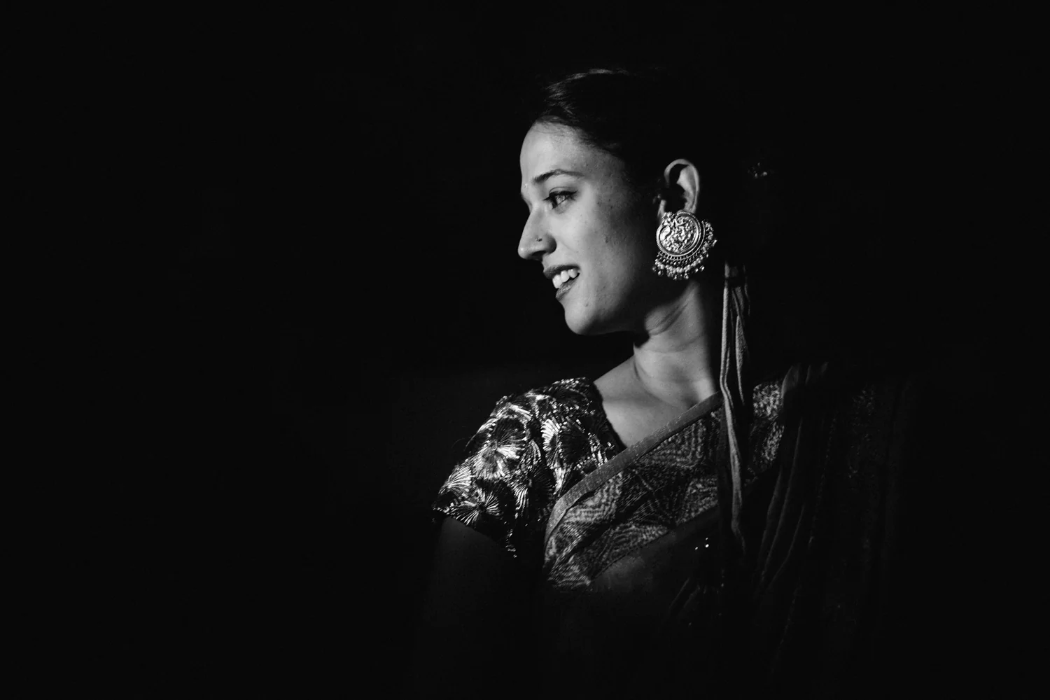 Black and white profile of bride smiling